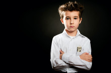 Little Boy Businessman Portrait In Low Key With Arms Crossed