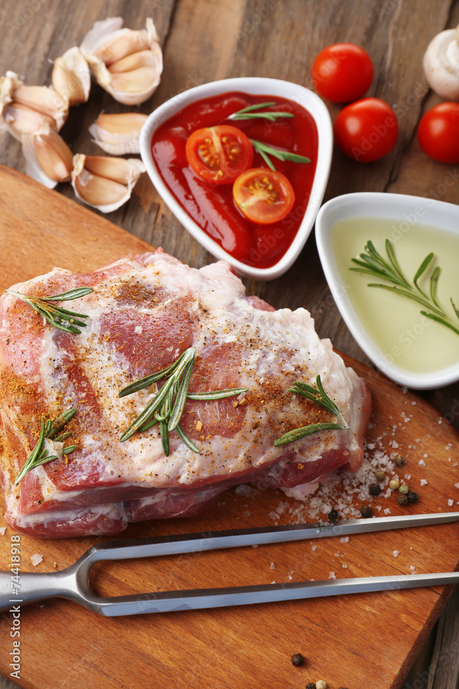 Raw meat on wooden table, close-up