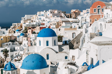 Wall Mural - Santorini cityscape with the blue dome in Oia, Greece.