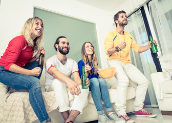 friends watching tv in the living room