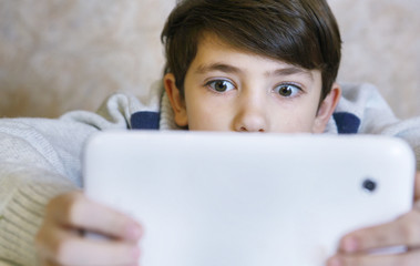 boy with pad playing game