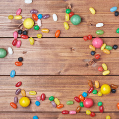 Wall Mural - Candies lying over the wooden surface