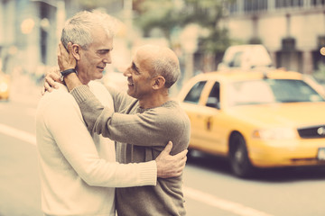 Wall Mural - Gay Couple with Traffic on Background in New York