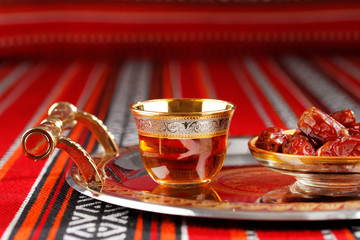 Iconic Abrian fabric tea and dates symbolise Arabian hospitality