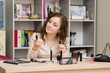 © madhourse - Girl in the office chooses cosmetic mascara