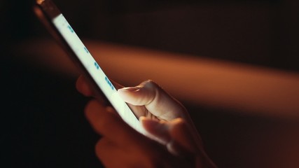 Close up of hands using smart phone