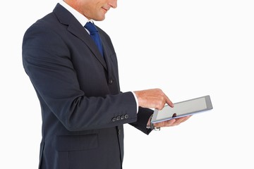 Poster - Businessman in suit using digital tablet