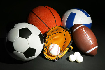 Wall Mural - Sports balls on black background