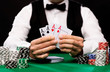 © Syda Productions - poker player with cards and chips at casino
