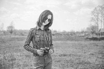 Poster - Girl with vintage photo camera. Black-white photo.