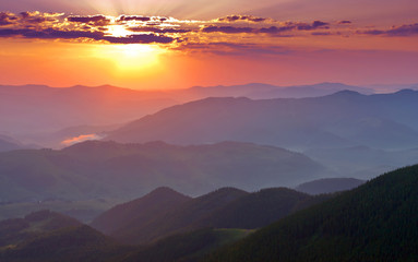 Wall Mural - Sunset in mountains