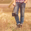 © arthurhidden - Young Man with retro photo camera outdoor hipster Lifestyle