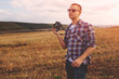 © arthurhidden - Young Man with retro photo camera outdoor hipster Lifestyle
