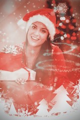 Poster - Composite image of festive brunette smiling at camera