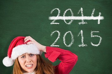Poster - Composite image of festive stressed redhead holding gifts