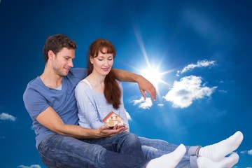 Poster - Composite image of couple using tablet at home