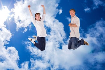 Aufkleber - Composite image of couple jumping in the air
