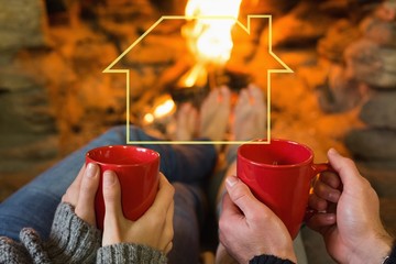 Poster - Hands with red coffee cups in front of lit fireplace