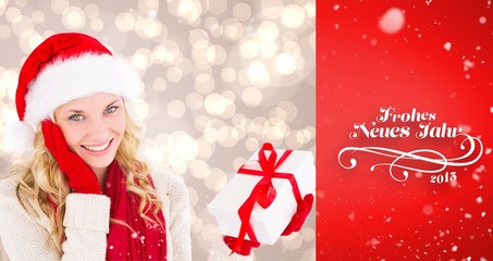Poster - Composite image of happy festive blonde with gift