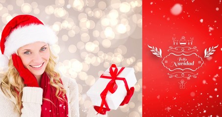 Poster - Composite image of happy festive blonde with gift