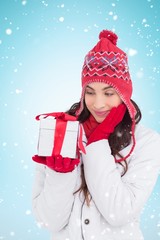 Poster - Brunette in winter clothes holding gift