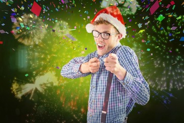 Poster - Composite image of geeky hipster wearing santa hat