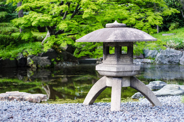 japanese traditional stone lantern in a park in tokyo