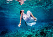 Gorgeous female dancing underwater