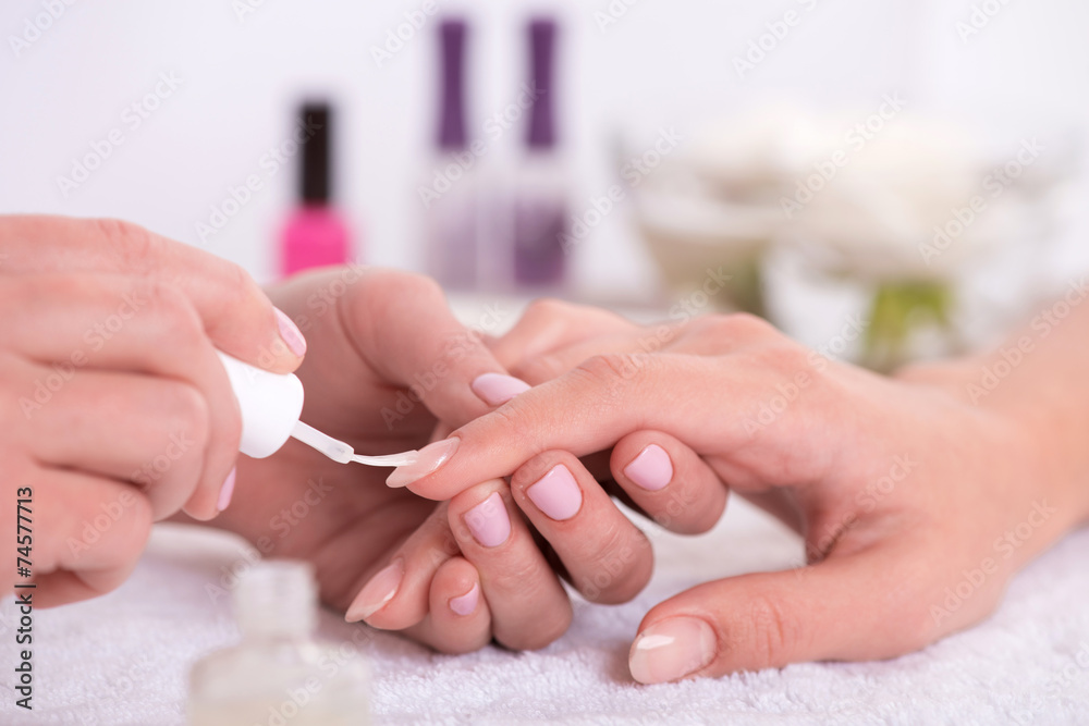 client and manicurist in manicure salon - obrazy, fototapety, plakaty 