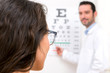 © Production Perig - Young attractive woman doing optician test