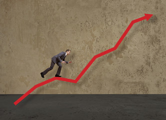 businessman jump over growing chart