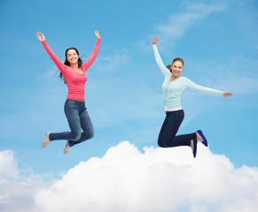 Sticker - smiling young women jumping in air