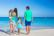 © travnikovstudio - Family of four with two kids during beach vacation