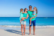 © travnikovstudio - Young happy family with two kids on summer vacation