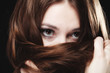 © Voyagerix - woman covers the face by long brown hairs