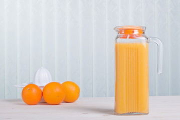 Sticker - orange juice beside delicious ripe oranges on the table