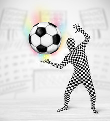 man in full body suit holdig soccer ball