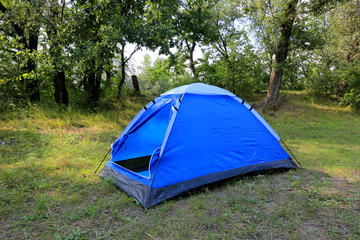 tourist tent in forest camp