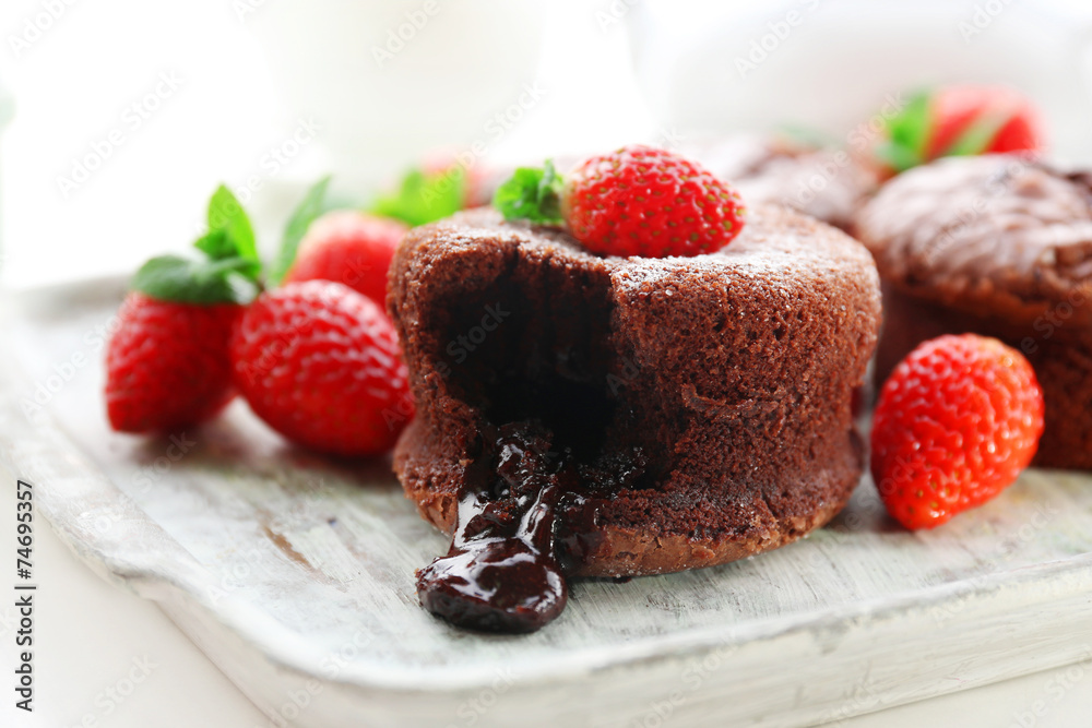 Hot chocolate pudding with fondant centre with strawberries,