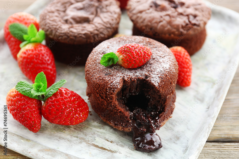 Hot chocolate pudding with fondant centre with strawberries,
