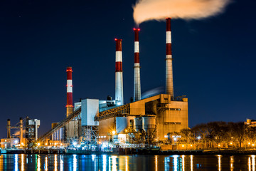 Power station with a steam cloud blown by the wind