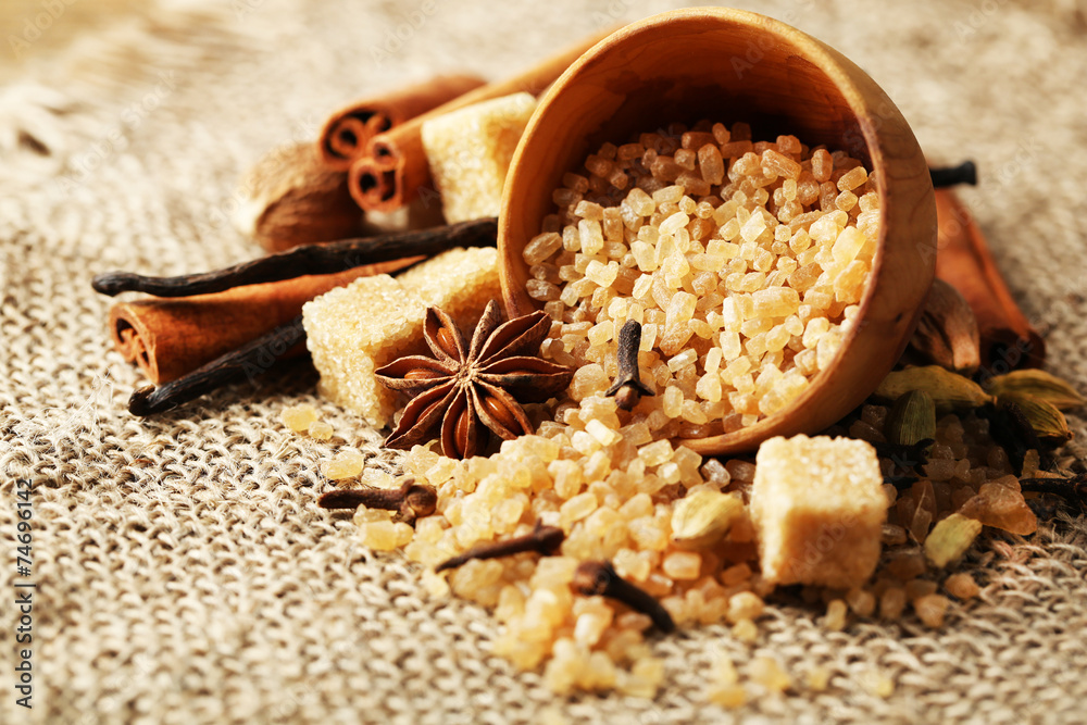 Christmas spices and baking ingredients on sackcloth background