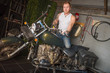 © Konstantin - Man sits on a motorcycle in the garage