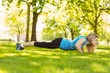 © WavebreakmediaMicro - Fit blonde doing push ups in the park