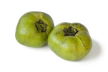 Two fresh black sapote fruit