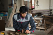 © adam121 - Carpenter at work