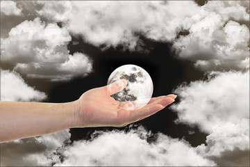 The full white moon in woman hand