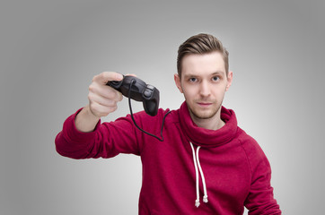 Wall Mural - Young slicked back hair man holding game controller