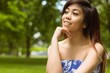 © WavebreakmediaMicro - Beautiful woman with hand on chin in park