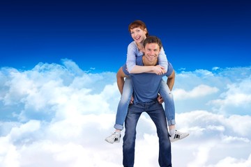 Poster - Composite image of man giving girl a piggy back